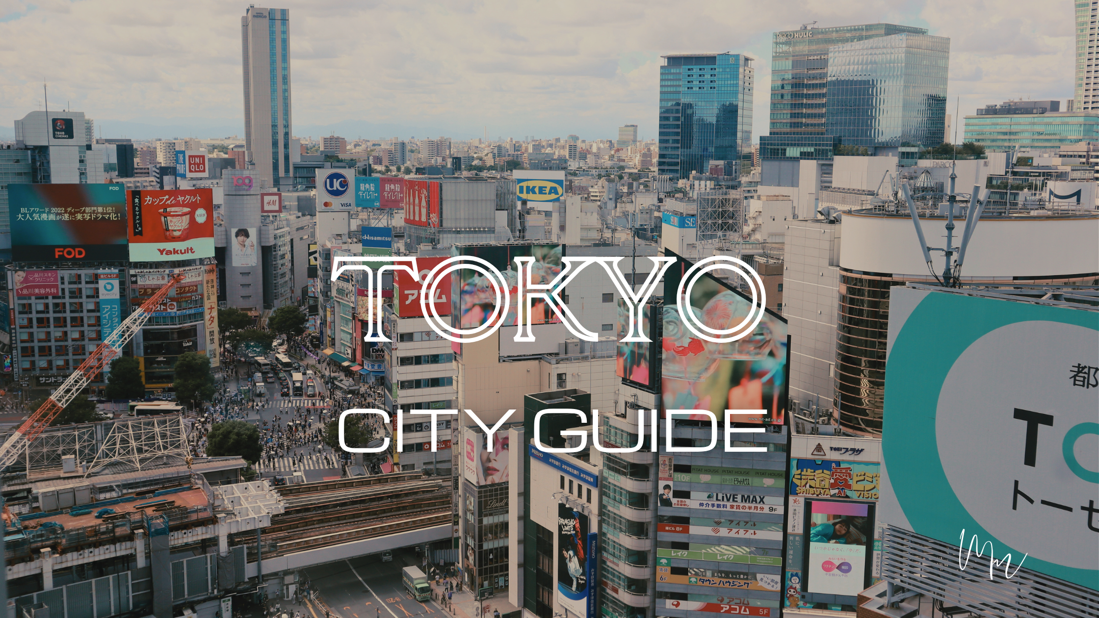 Tokyo City Guide title overlaying a view of Shibuya, Tokyo skyline