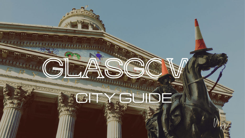 GLASGOW CITY GUIDE. Duke of Wellington statue with traffic cones outside the Glasgow Gallery of Modern Art.